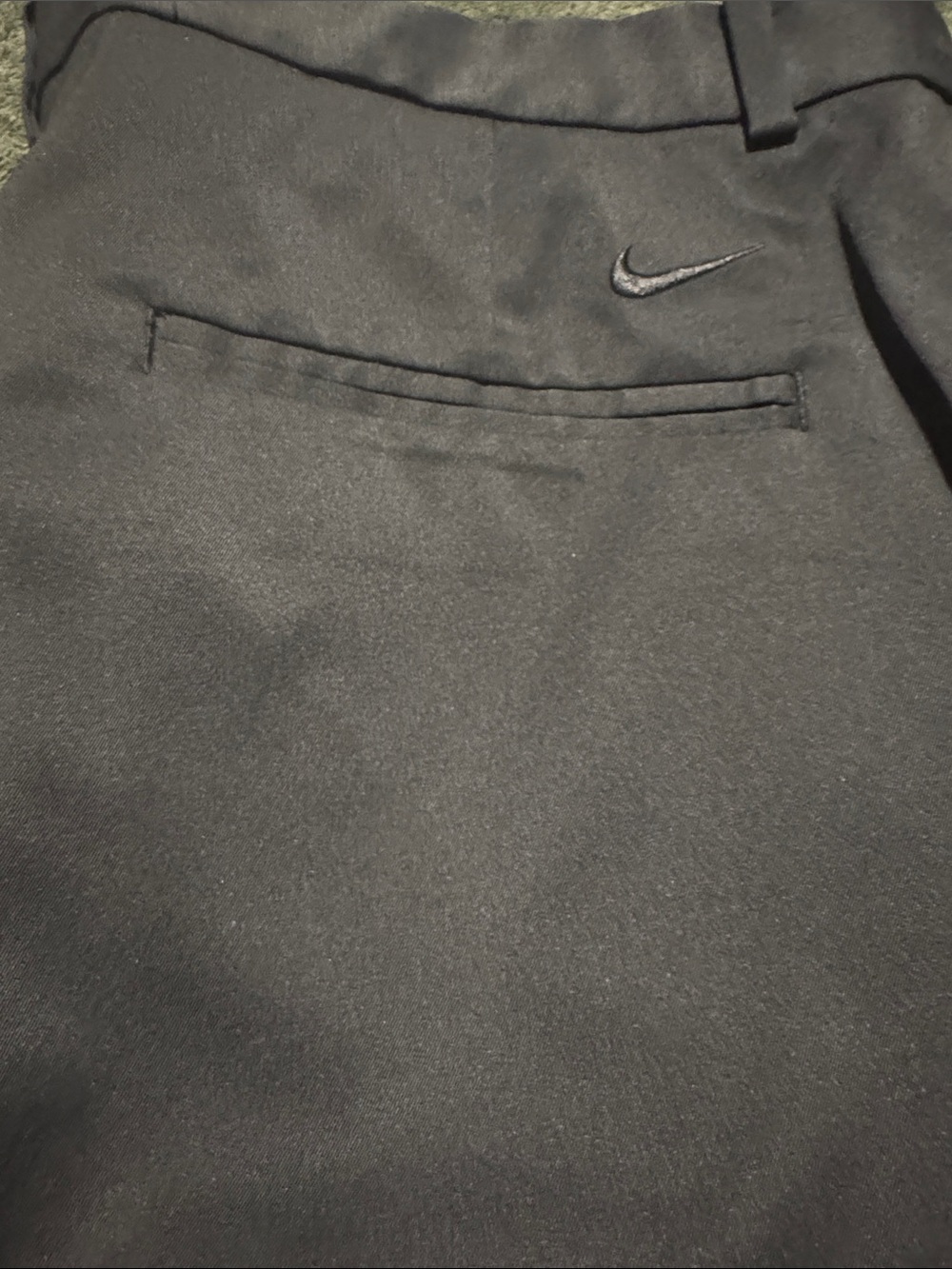 Nike Black Golf Short with Subtle Swoosh Accent. 9 in length